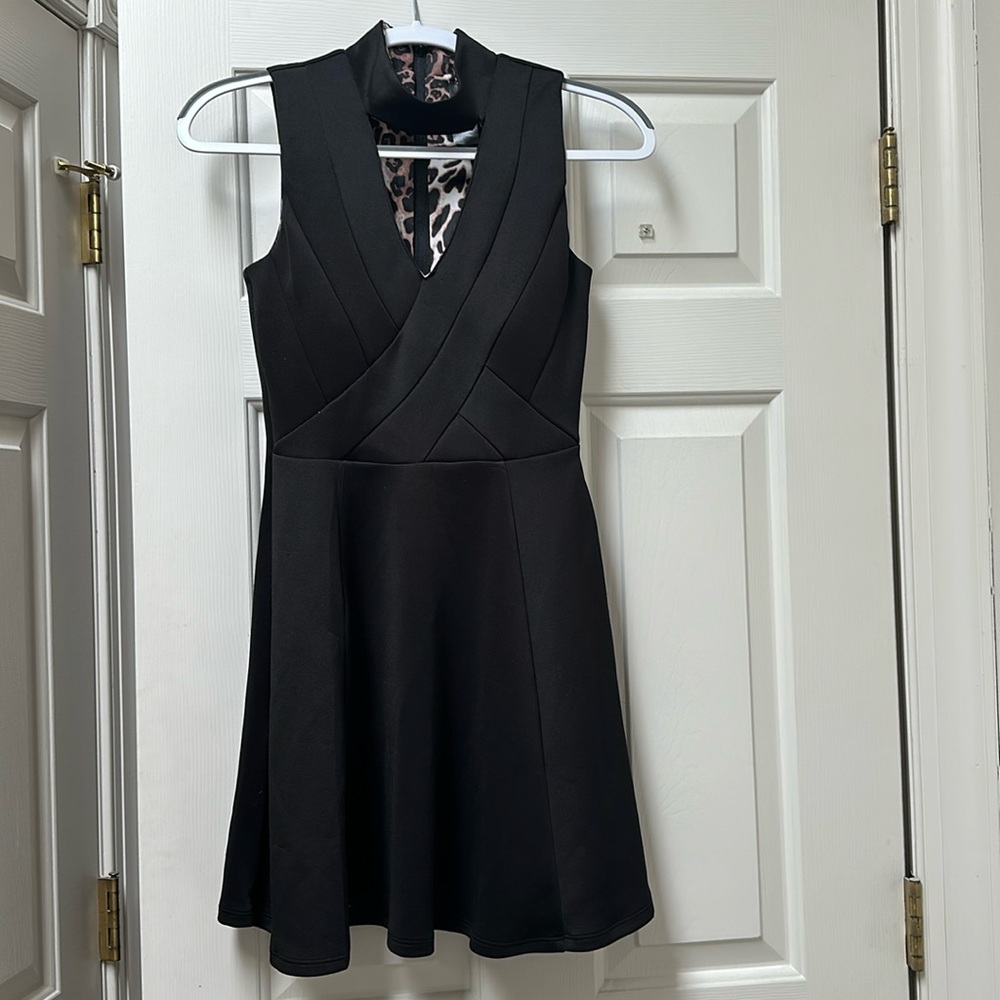 Gorgeous black dress with high neck and open at the chest